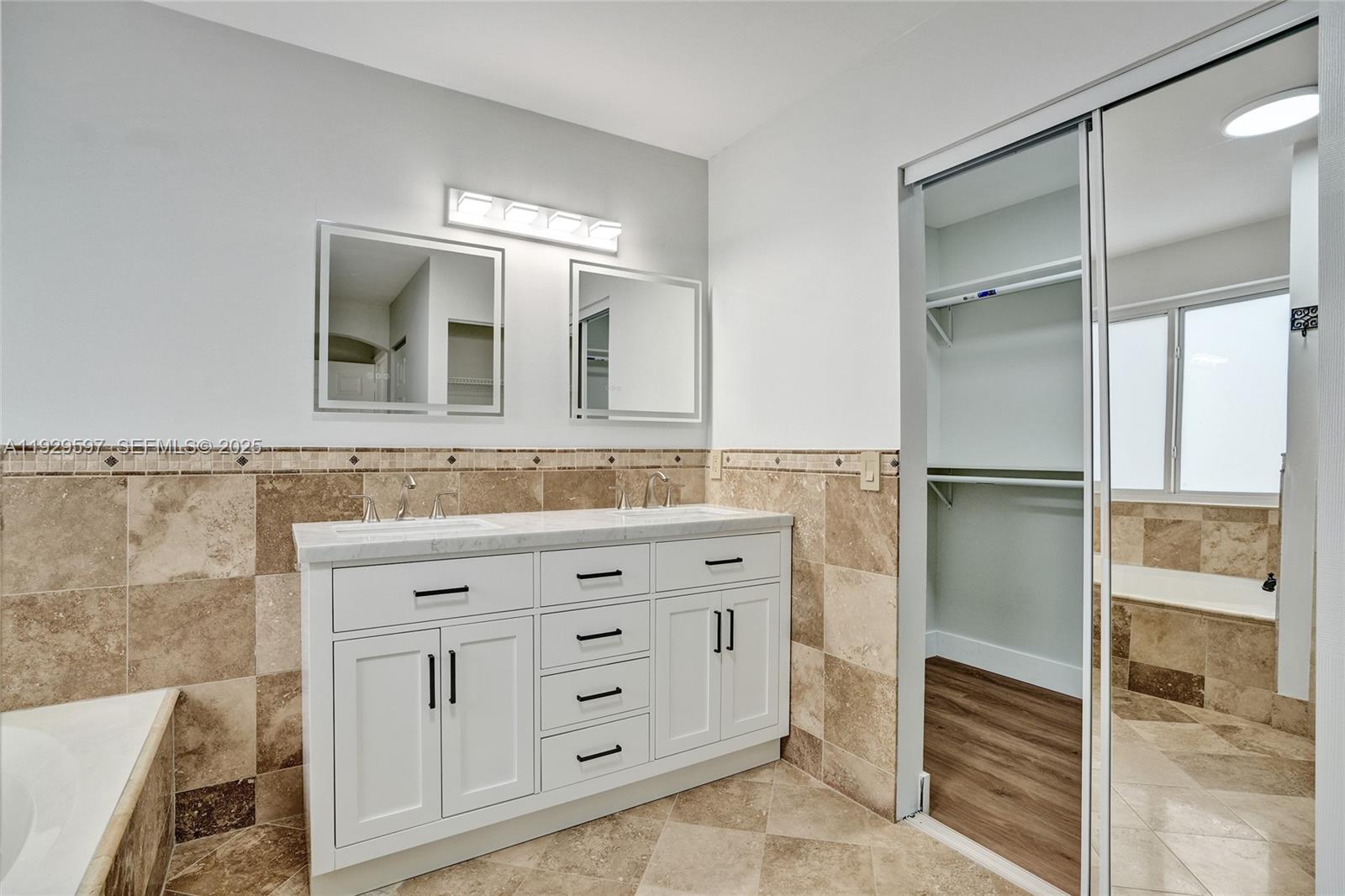 4120 Fern Forest Road Cooper City, FL 33026 - Photo 20 of 44 a bathroom with a double vanity sink and mirror