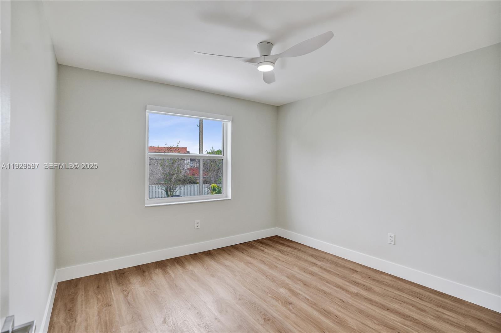 4120 Fern Forest Road Cooper City, FL 33026 - Photo 23 of 44 wooden floor in an empty room with a window