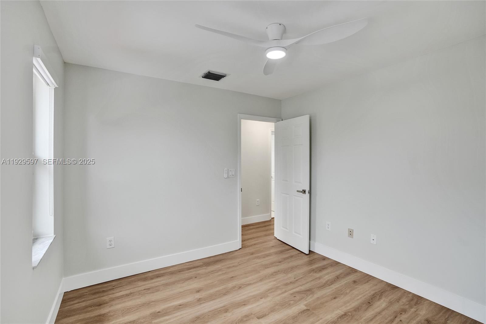 4120 Fern Forest Road Cooper City, FL 33026 - Photo 27 of 44 a view of an empty room with wooden floor