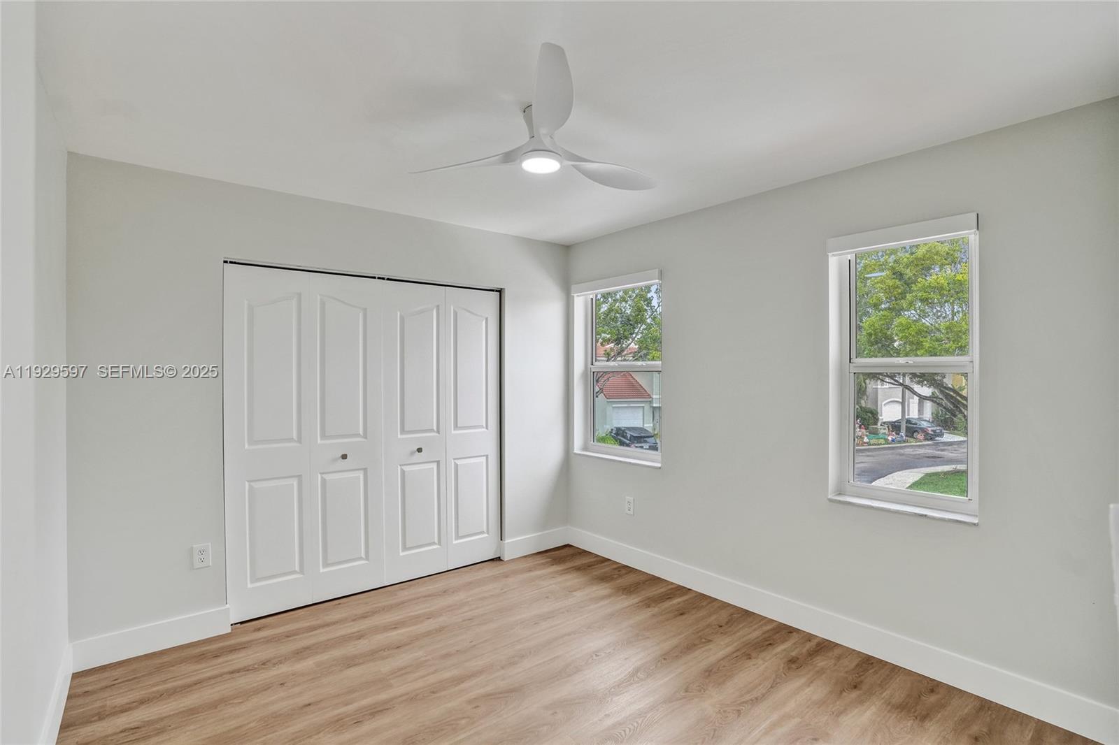 4120 Fern Forest Road Cooper City, FL 33026 - Photo 30 of 44 wooden floor in an empty room with a window