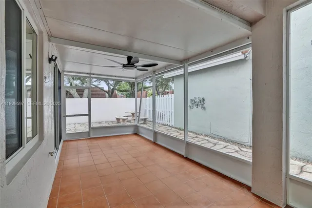 a view of an empty room with a sliding door