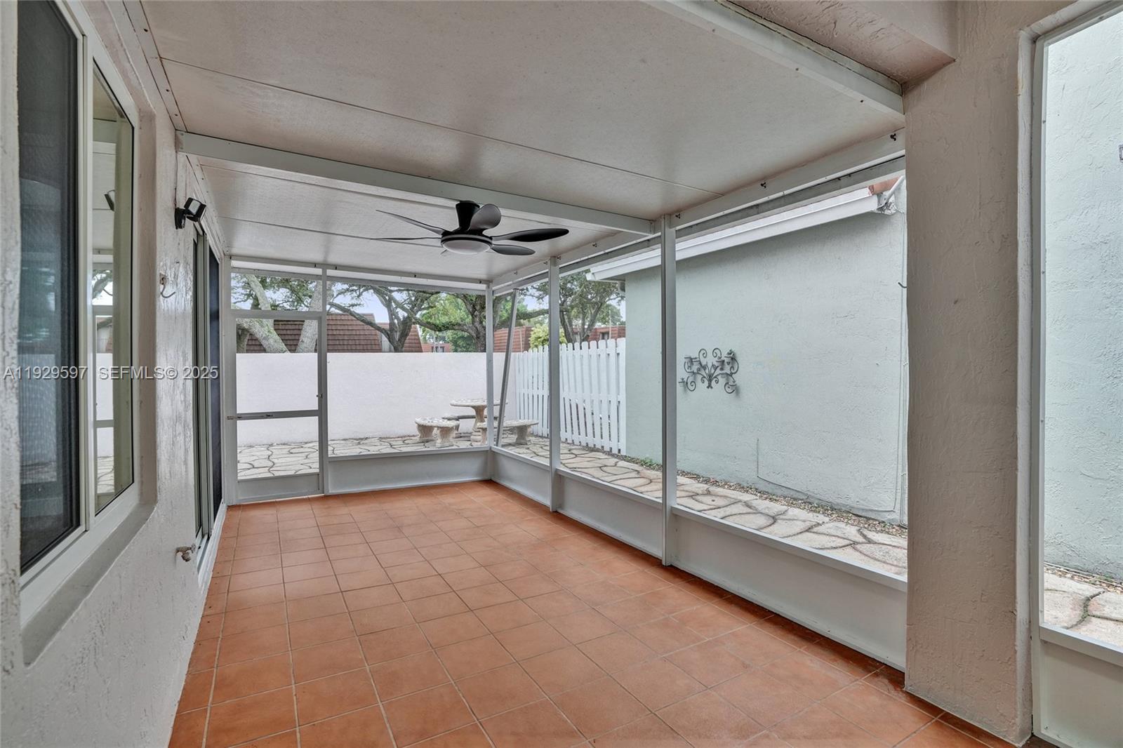 4120 Fern Forest Road Cooper City, FL 33026 - Photo 34 of 44 a view of an empty room with a sliding door