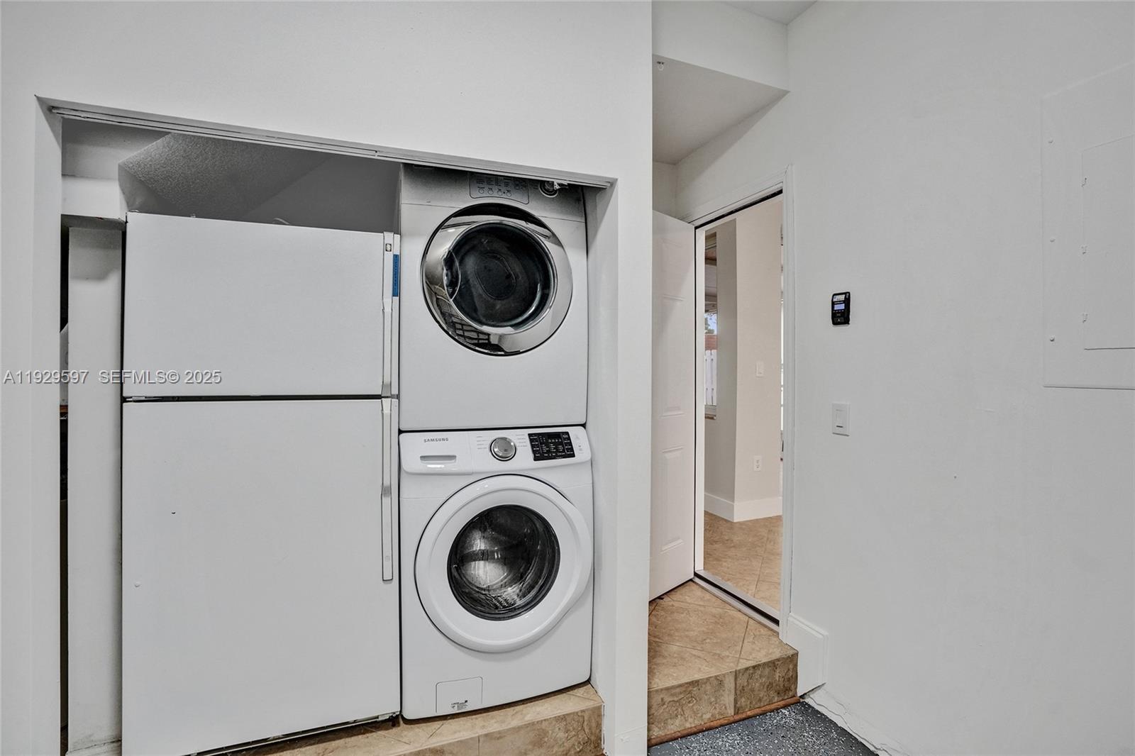 4120 Fern Forest Road Cooper City, FL 33026 - Photo 38 of 44 a utility room with dryer and washer