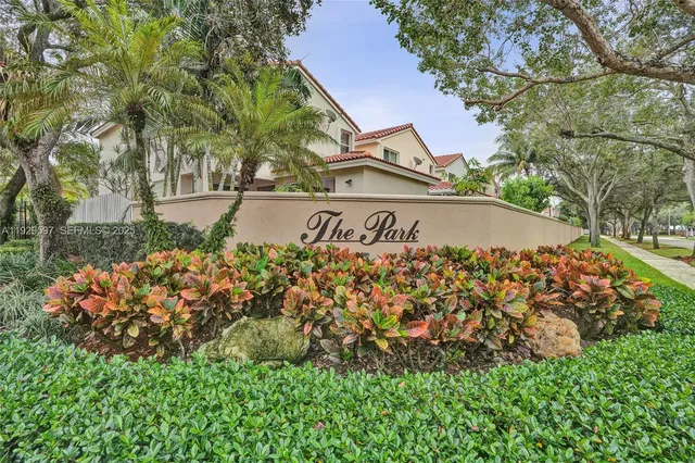 a view of road with houses and trees
