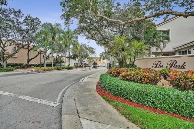 a view of a house with swimming pool and sitting area