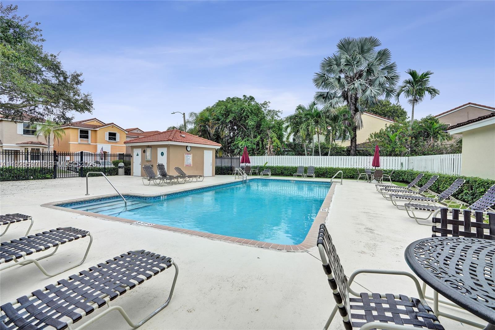 4120 Fern Forest Road Cooper City, FL 33026 - Photo 43 of 44 a view of a house with swimming pool and sitting area