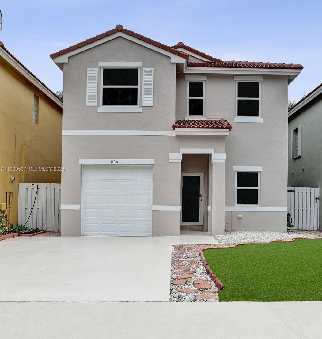 4120 Fern Forest Road Cooper City, FL 33026 - Photo 44 of 44 a view of a house with a garden