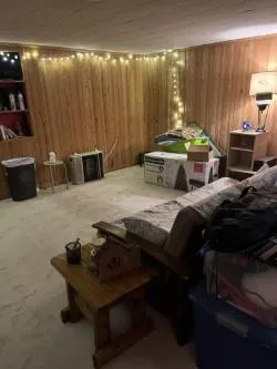 a room with gym equipment and a table