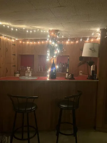 a bed room with furniture and a chandelier