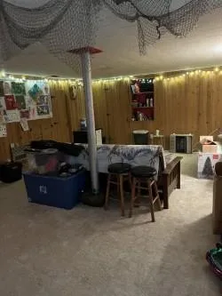 a view of a backyard with furniture and a fire pit