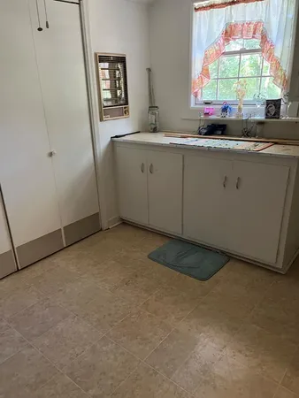 a kitchen with stainless steel appliances granite countertop a sink a stove and a microwave