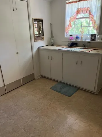 a kitchen with stainless steel appliances granite countertop a sink a stove and a microwave