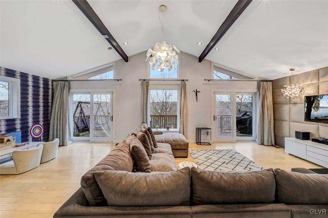 108 Sterling Circle Bushkill, PA 18324 - Photo 12 of 51 a living room with furniture chandelier and fireplace