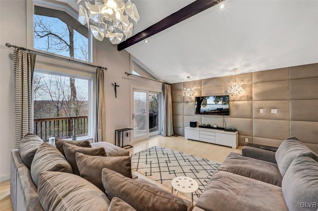 108 Sterling Circle Bushkill, PA 18324 - Photo 13 of 51 a living room with furniture or outdoor view and a large window
