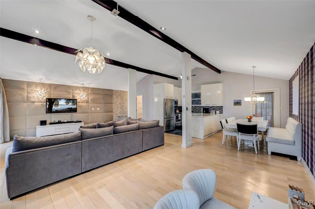 108 Sterling Circle Bushkill, PA 18324 - Photo 51 of 51 a living room with furniture kitchen view and a chandelier