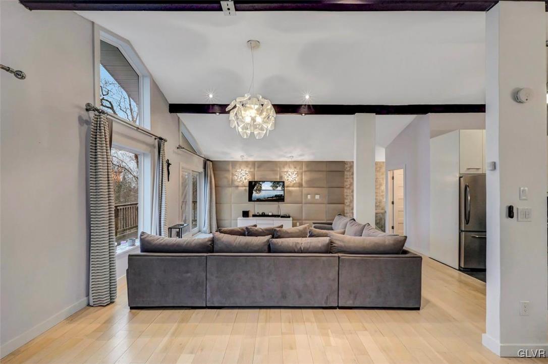 108 Sterling Circle Bushkill, PA 18324 - Photo 15 of 51 a living room with furniture and a chandelier