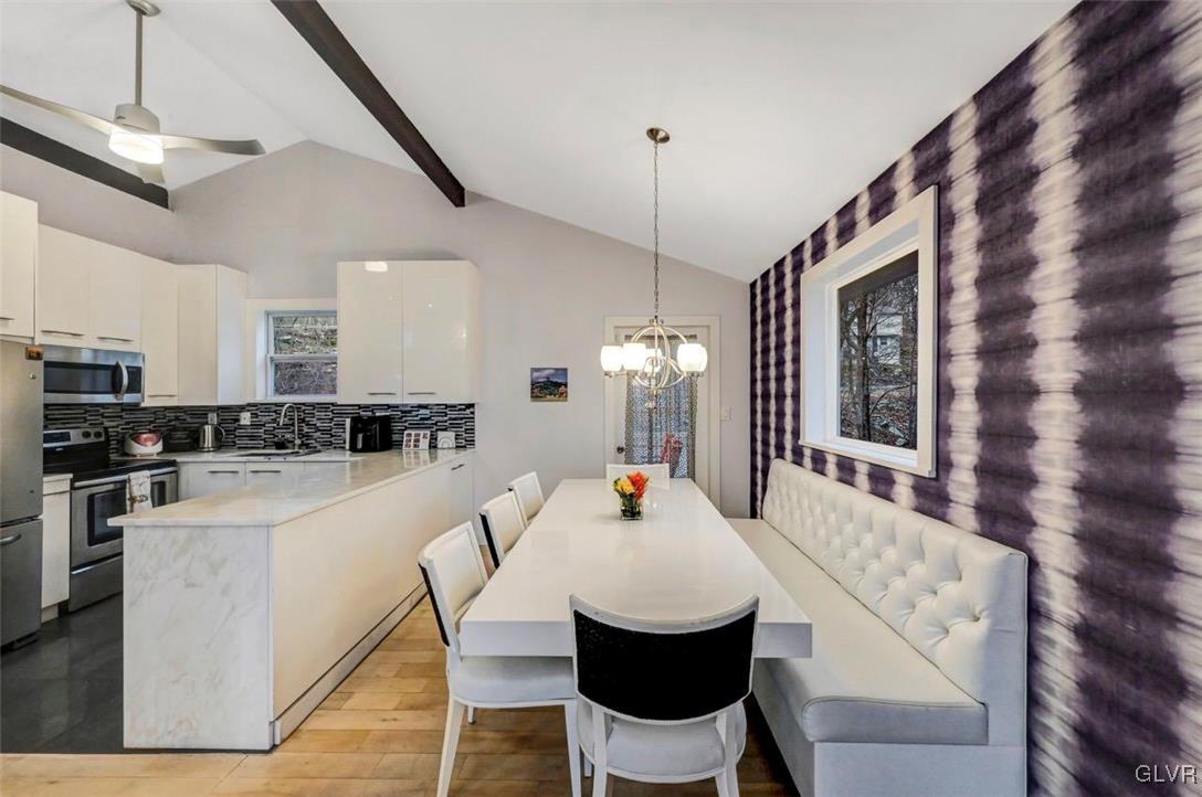 108 Sterling Circle Bushkill, PA 18324 - Photo 16 of 51 a view of a dining room with furniture and wooden floor
