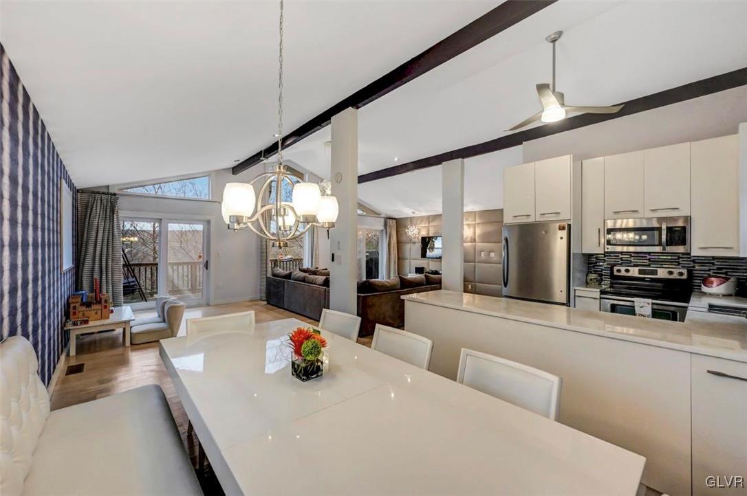 108 Sterling Circle Bushkill, PA 18324 - Photo 17 of 51 a kitchen with stainless steel appliances kitchen island granite countertop a sink and cabinets