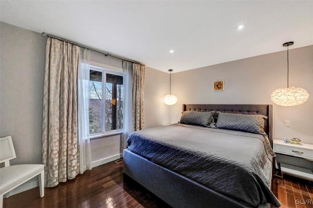 108 Sterling Circle Bushkill, PA 18324 - Photo 31 of 51 a bedroom with a bed and wooden floor