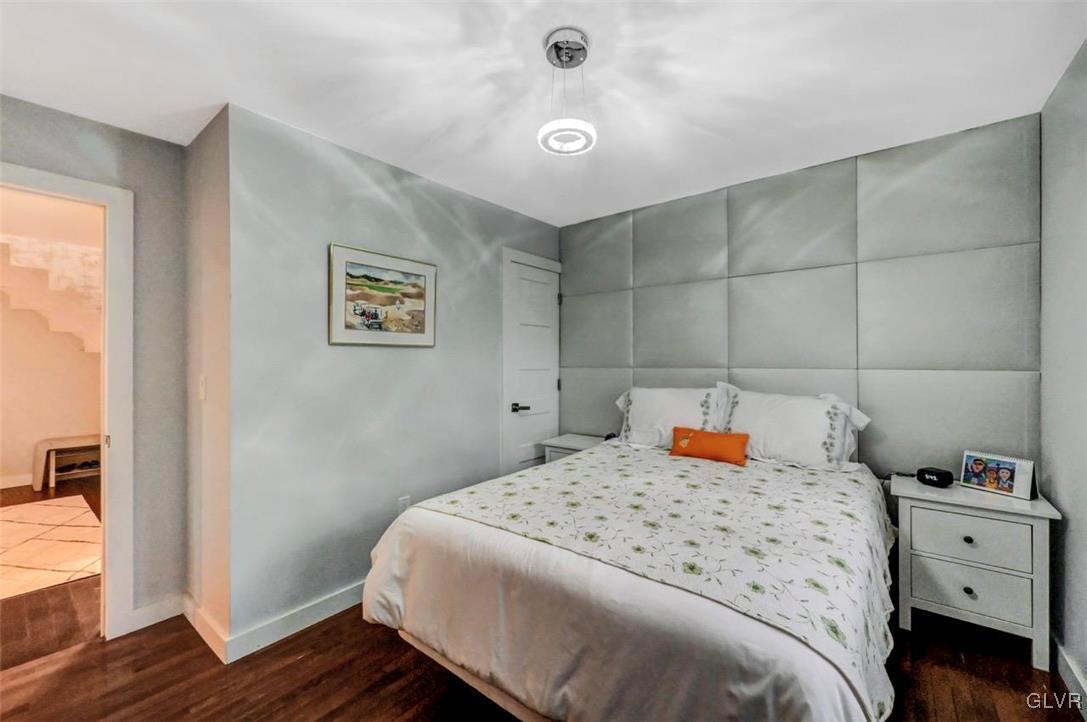 108 Sterling Circle Bushkill, PA 18324 - Photo 37 of 51 a bedroom with a bed and wooden floor