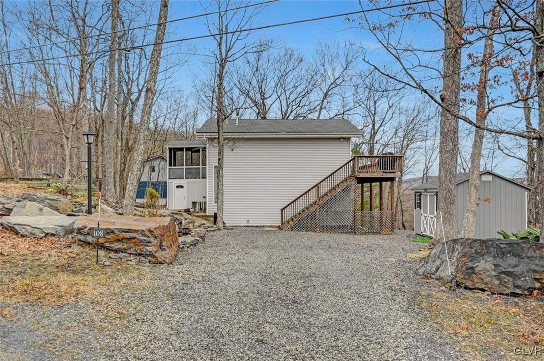 108 Sterling Circle Bushkill, PA 18324 - Photo 49 of 51 a view of backyard with a large tree