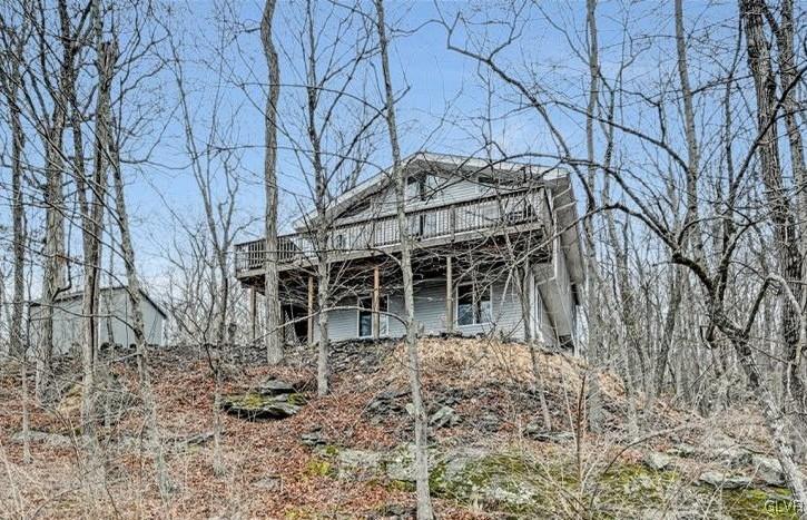 108 Sterling Circle Bushkill, PA 18324 - Photo 5 of 51 a view of a house with a yard and large trees