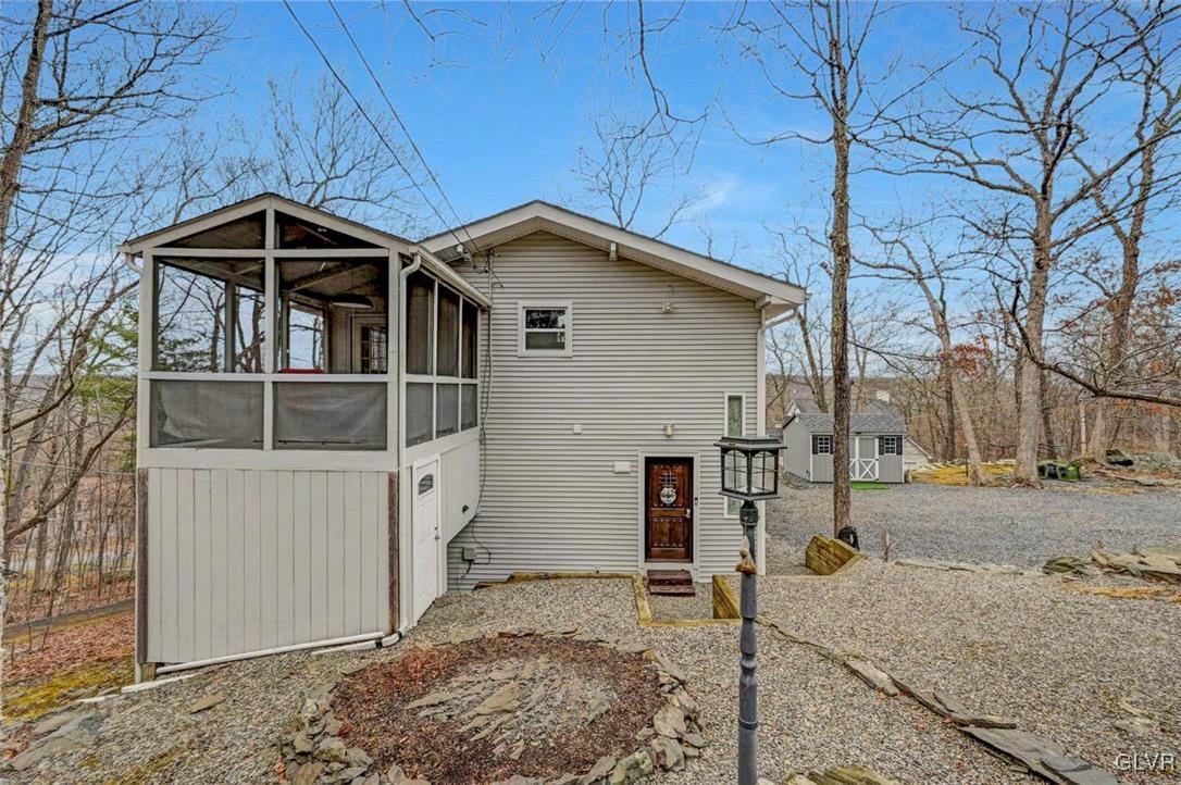 108 Sterling Circle Bushkill, PA 18324 - Photo 7 of 51 a front view of a house with trees