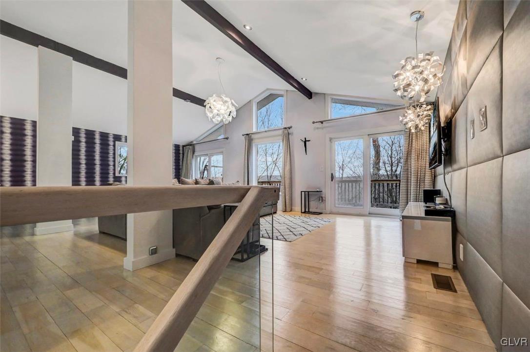 108 Sterling Circle Bushkill, PA 18324 - Photo 10 of 51 a living room with furniture and a chandelier