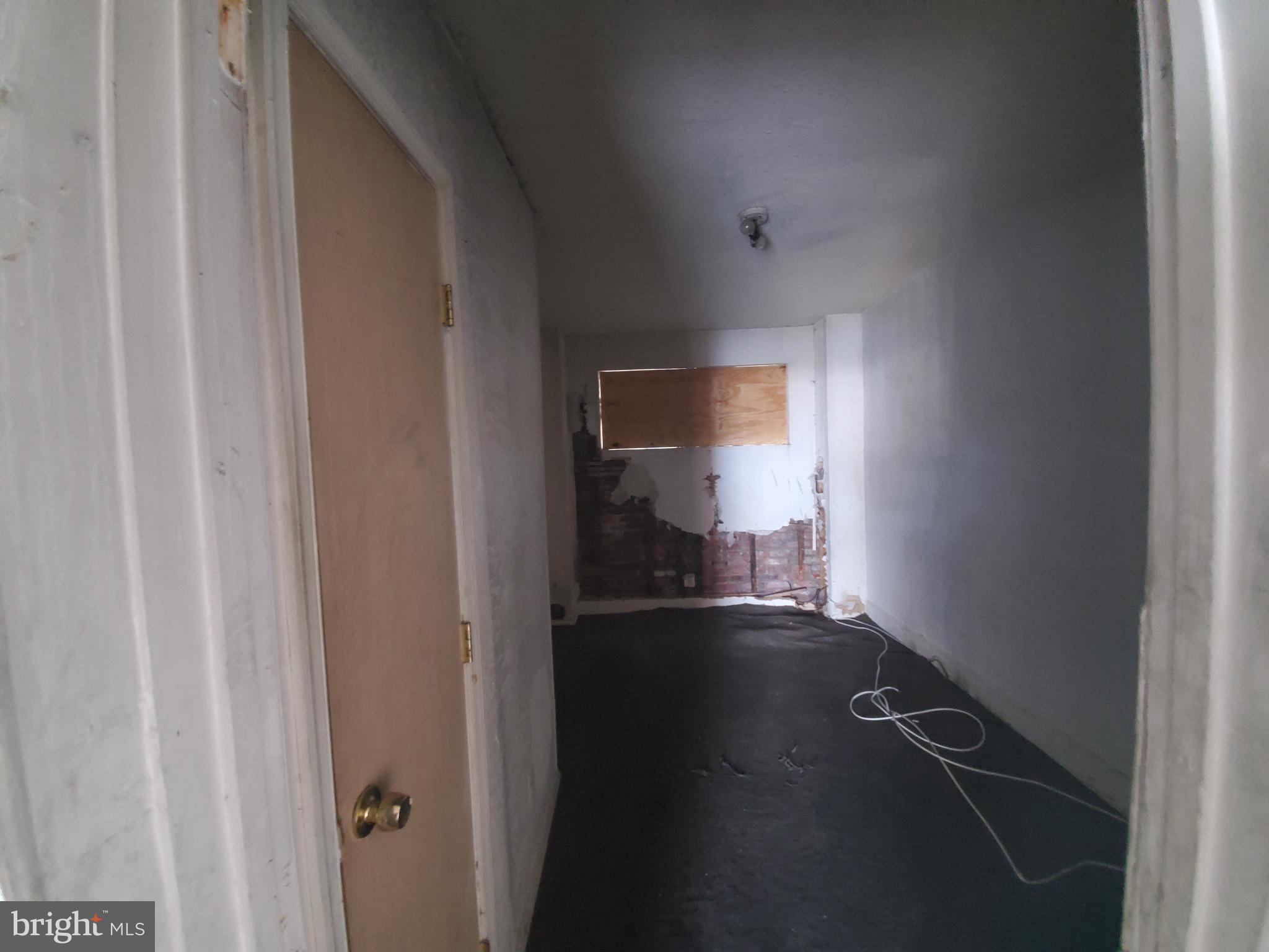 2002 East Rittenhouse Street Philadelphia, PA 19138 - Photo 8 of 10 a view of a hallway with wooden floor and a cabinet
