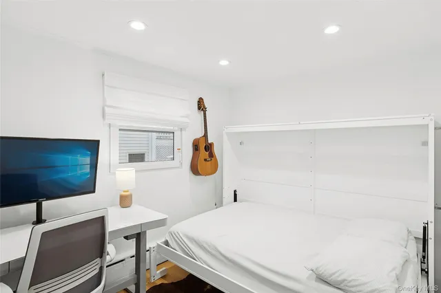 a bathroom with a sink a toilet and a shower