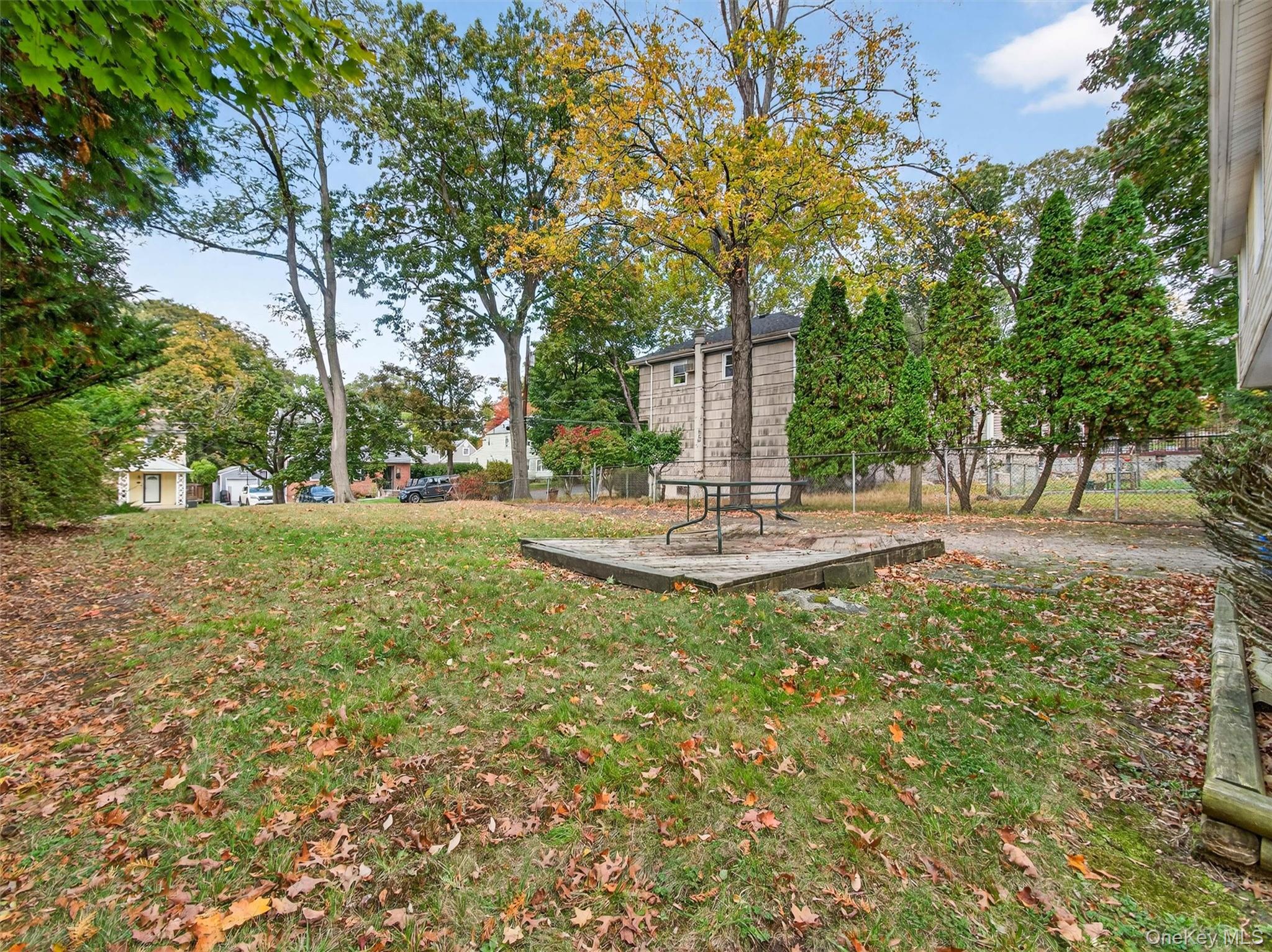 5 Interstate Street Suffern, NY 10901 - Photo 9 of 15 a view of a fire pit with a trees