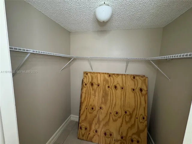 a bathroom with a shower and a mirror