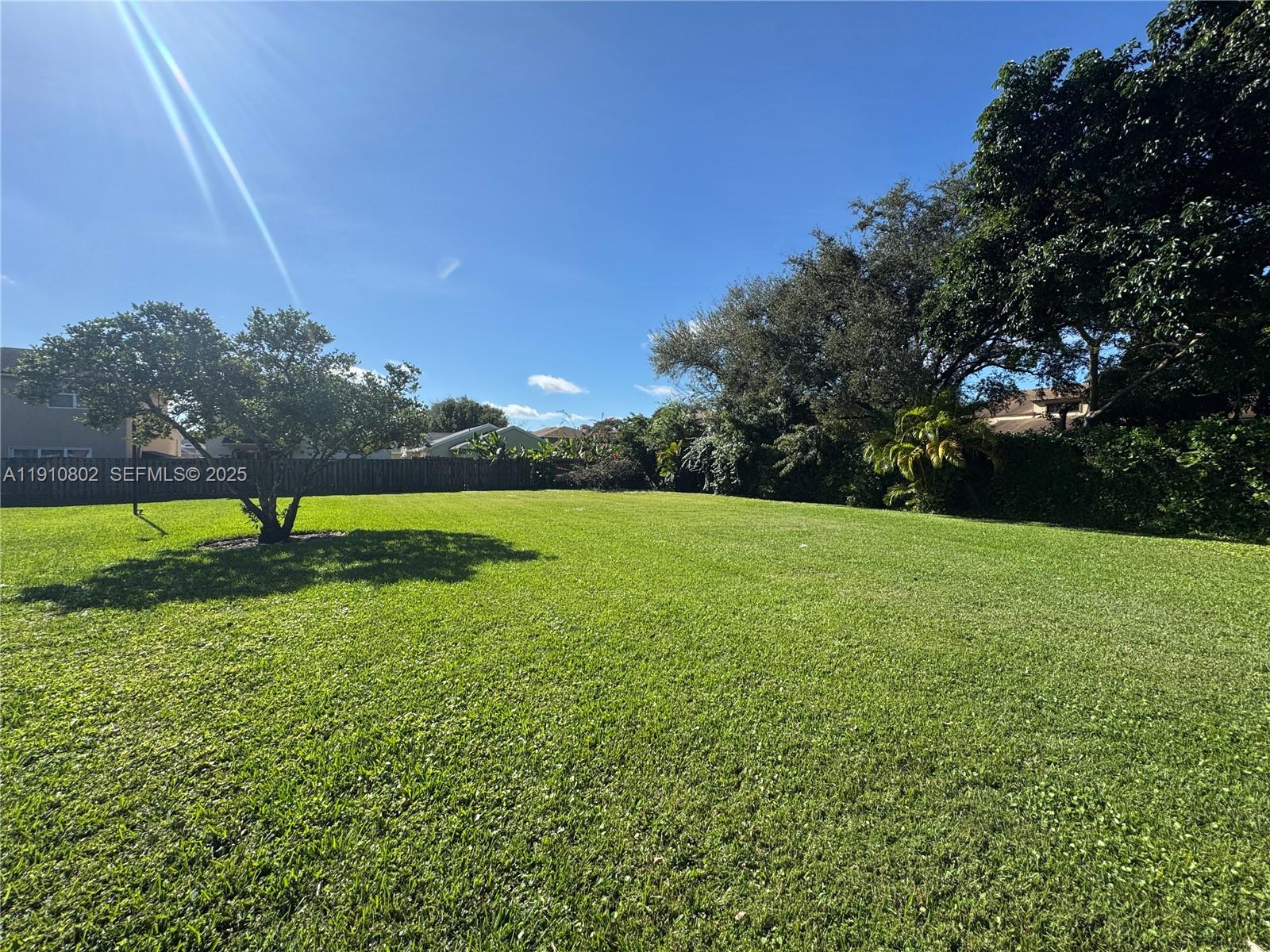 6031 Shaker Wood Circle, Unit 101 Tamarac, FL 33319 - Photo 28 of 28 a view of a golf course with a garden