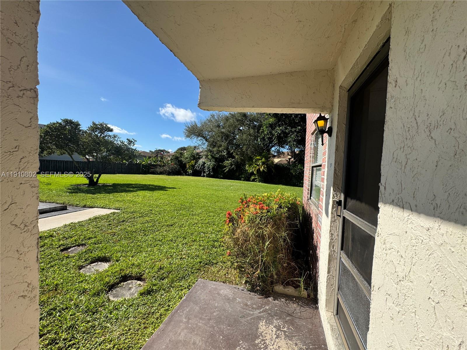 6031 Shaker Wood Circle, Unit 101 Tamarac, FL 33319 - Photo 3 of 28 a view of an entrance