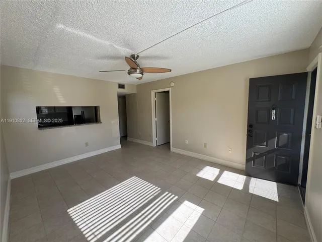 a view of a hallway with a livingroom