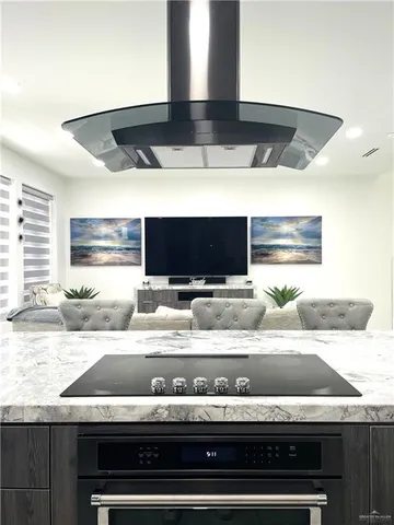 a bathroom with a granite countertop sink and a washing machine