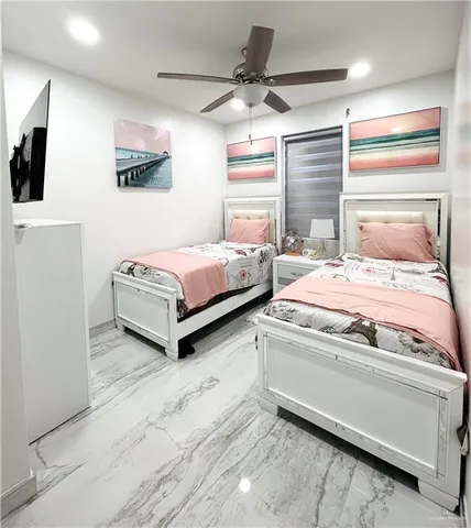 a bedroom with a bed and window