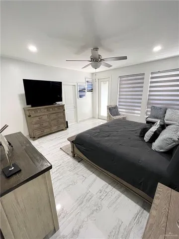 a large bathroom with a large tub and sink