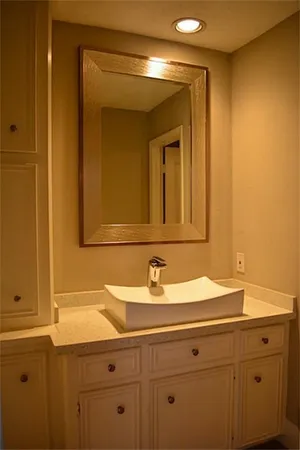 a bathroom with a sink and a mirror