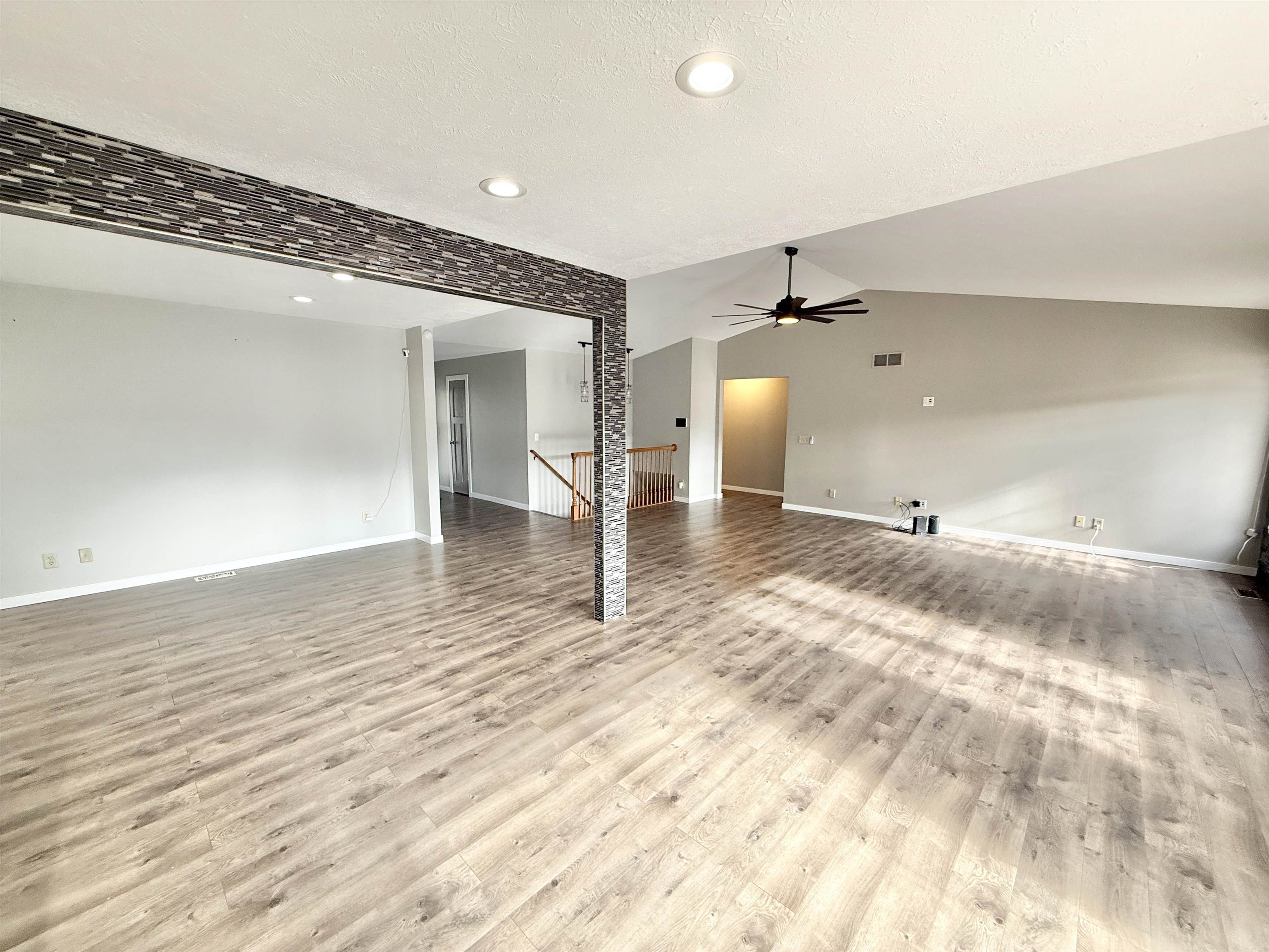 11008 Chicory Ridge Way Roscoe, IL 61073 - Photo 13 of 45 a view of a livingroom with wooden floor and a rug