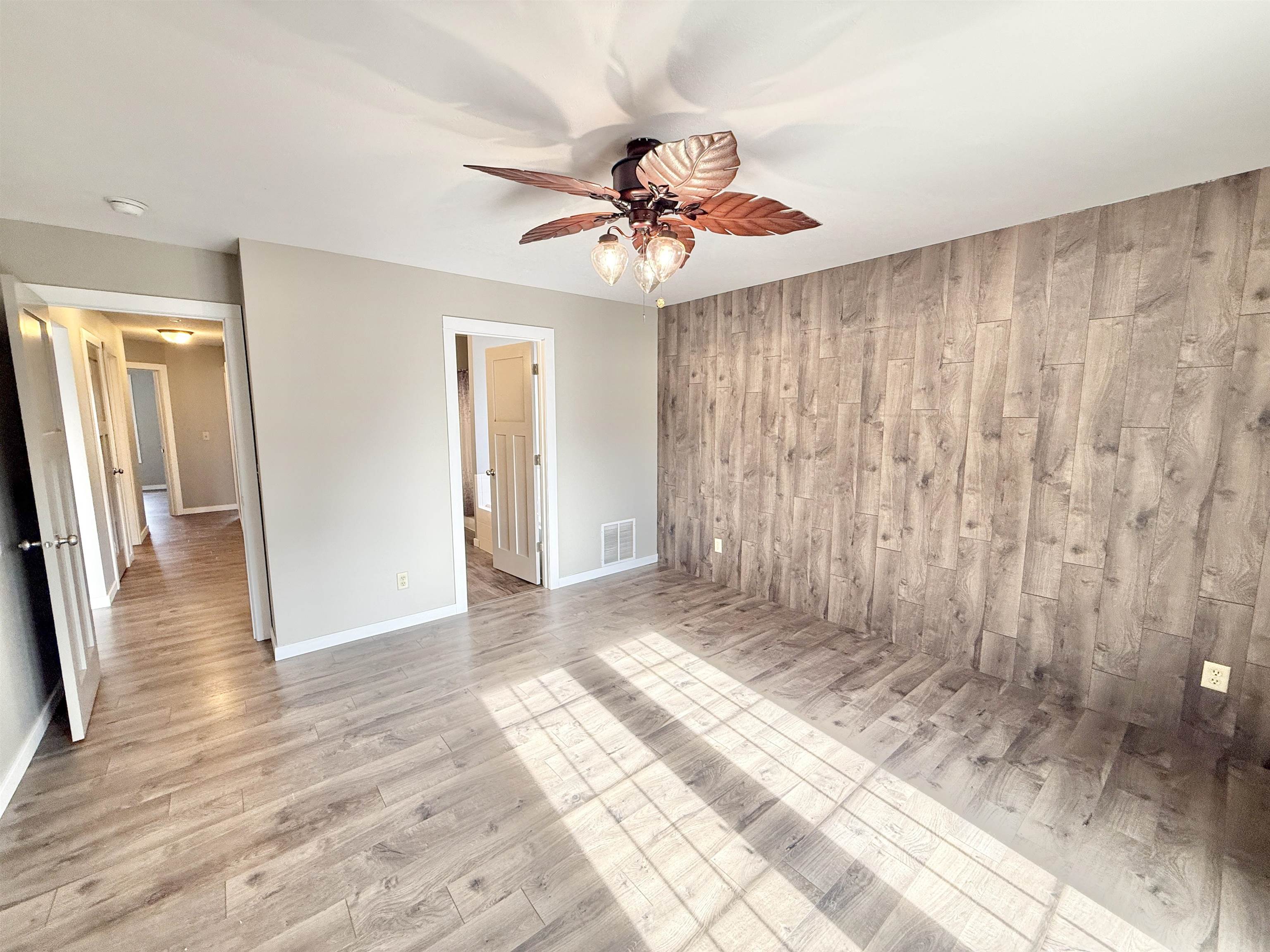11008 Chicory Ridge Way Roscoe, IL 61073 - Photo 14 of 45 wooden floor in an empty room with a window