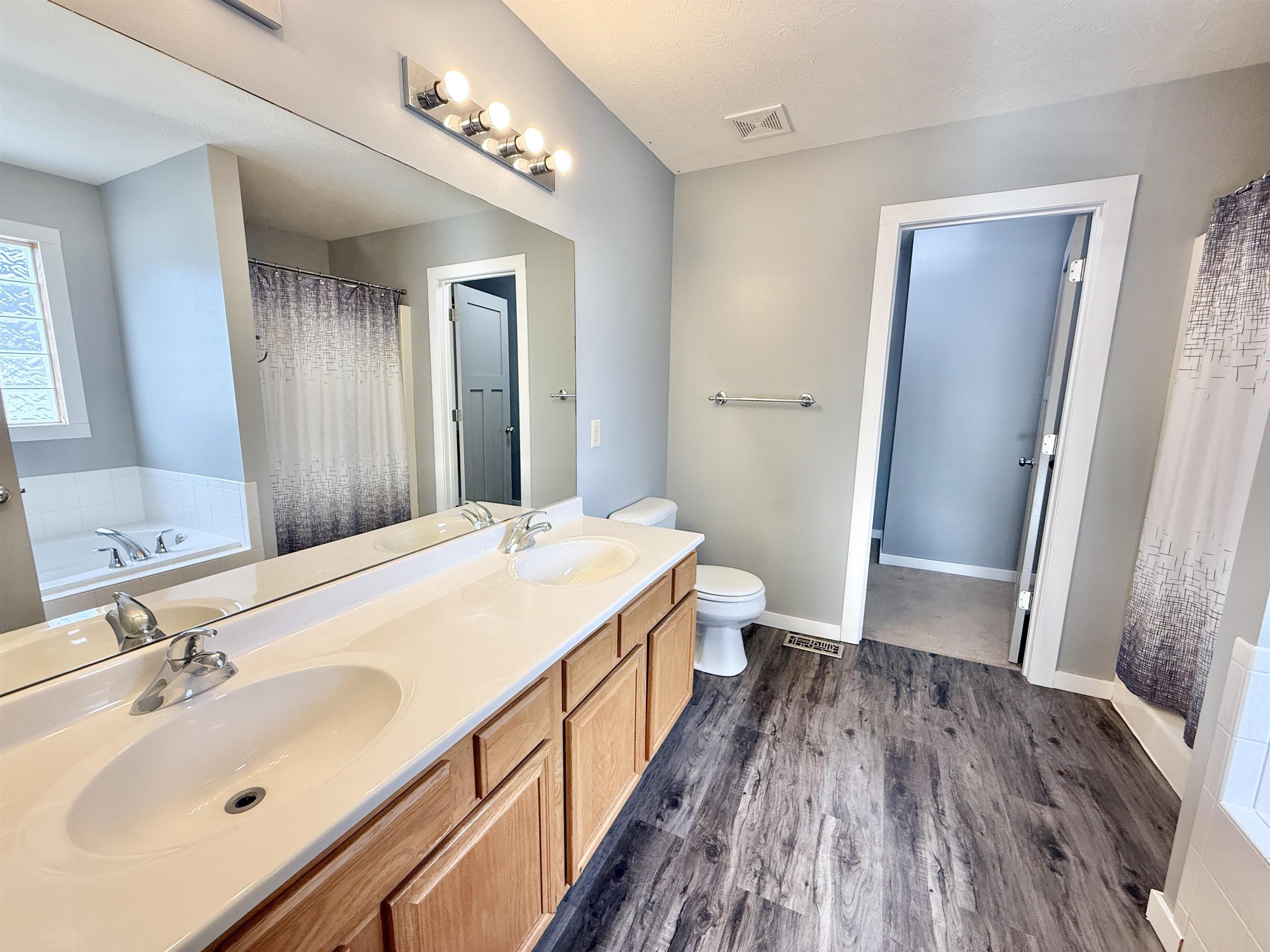 11008 Chicory Ridge Way Roscoe, IL 61073 - Photo 25 of 45 a spacious bathroom with a double vanity sink and a mirror