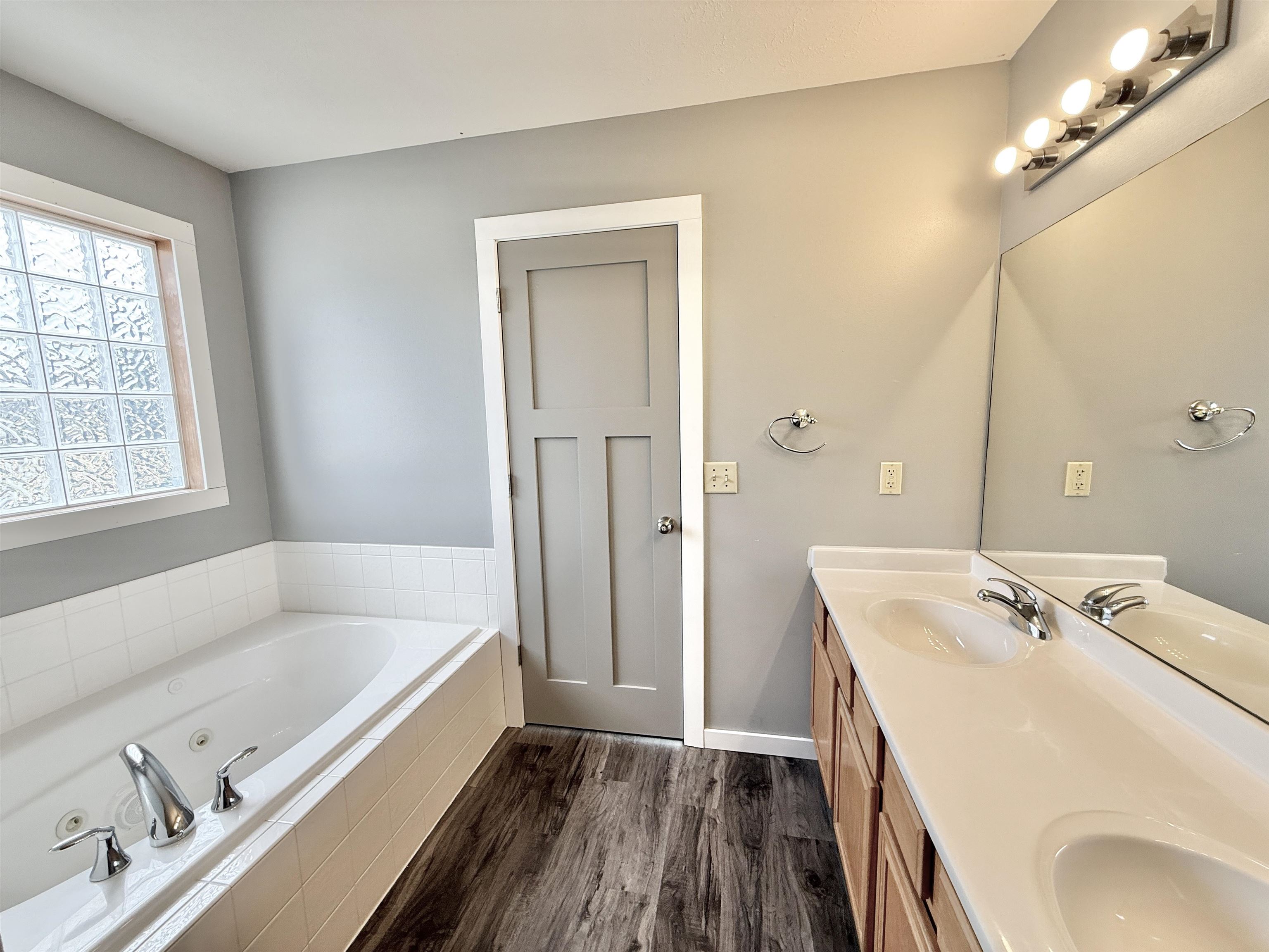 11008 Chicory Ridge Way Roscoe, IL 61073 - Photo 26 of 45 a bathroom with a tub sink and mirror