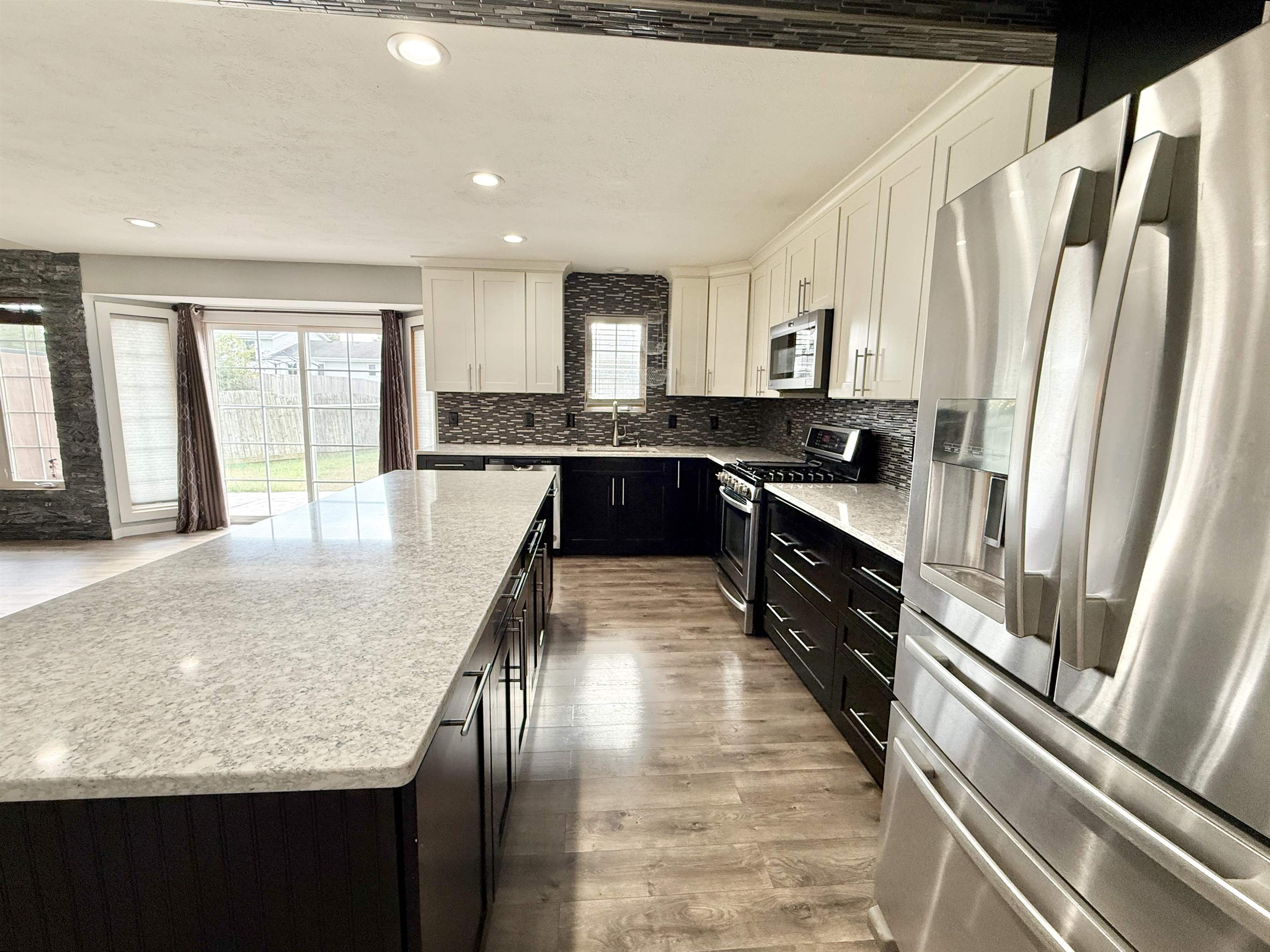 11008 Chicory Ridge Way Roscoe, IL 61073 - Photo 4 of 45 a large kitchen with kitchen island granite countertop a large window