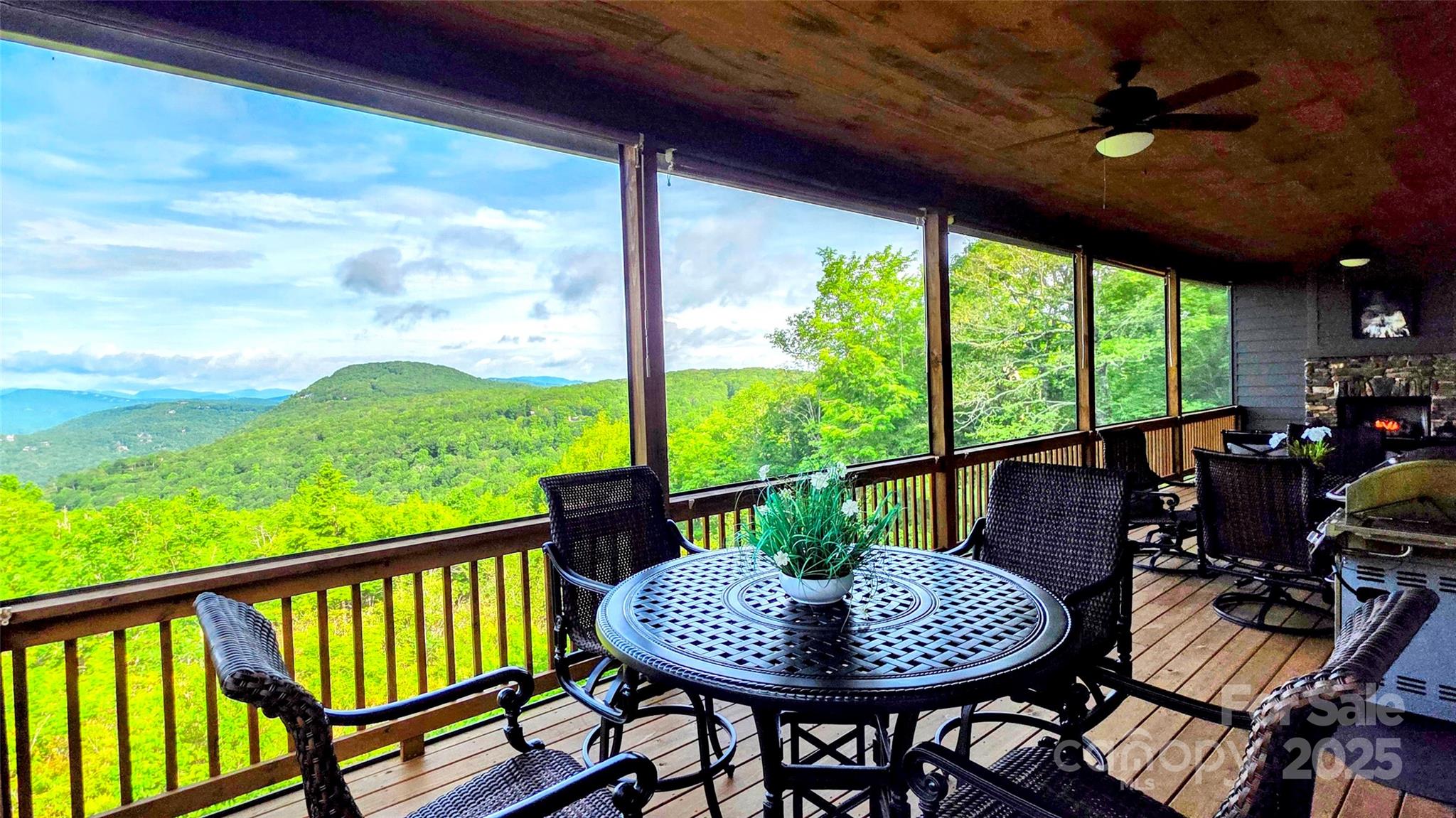 71 Raptor Way Sapphire, NC 28774 - Photo 18 of 46 a view of a patio with a table chairs and a yard