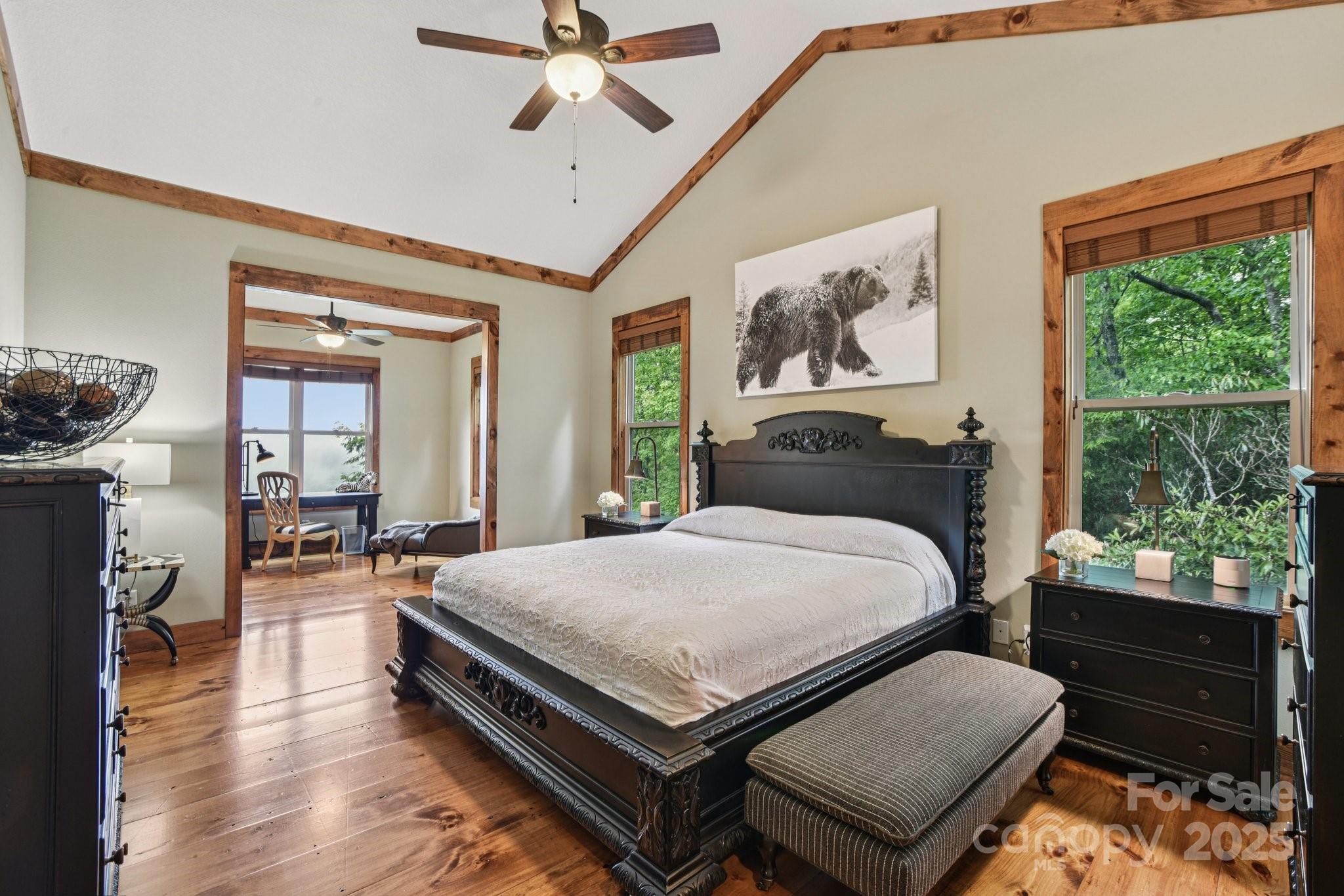71 Raptor Way Sapphire, NC 28774 - Photo 21 of 46 a bedroom with a bed and wooden floor
