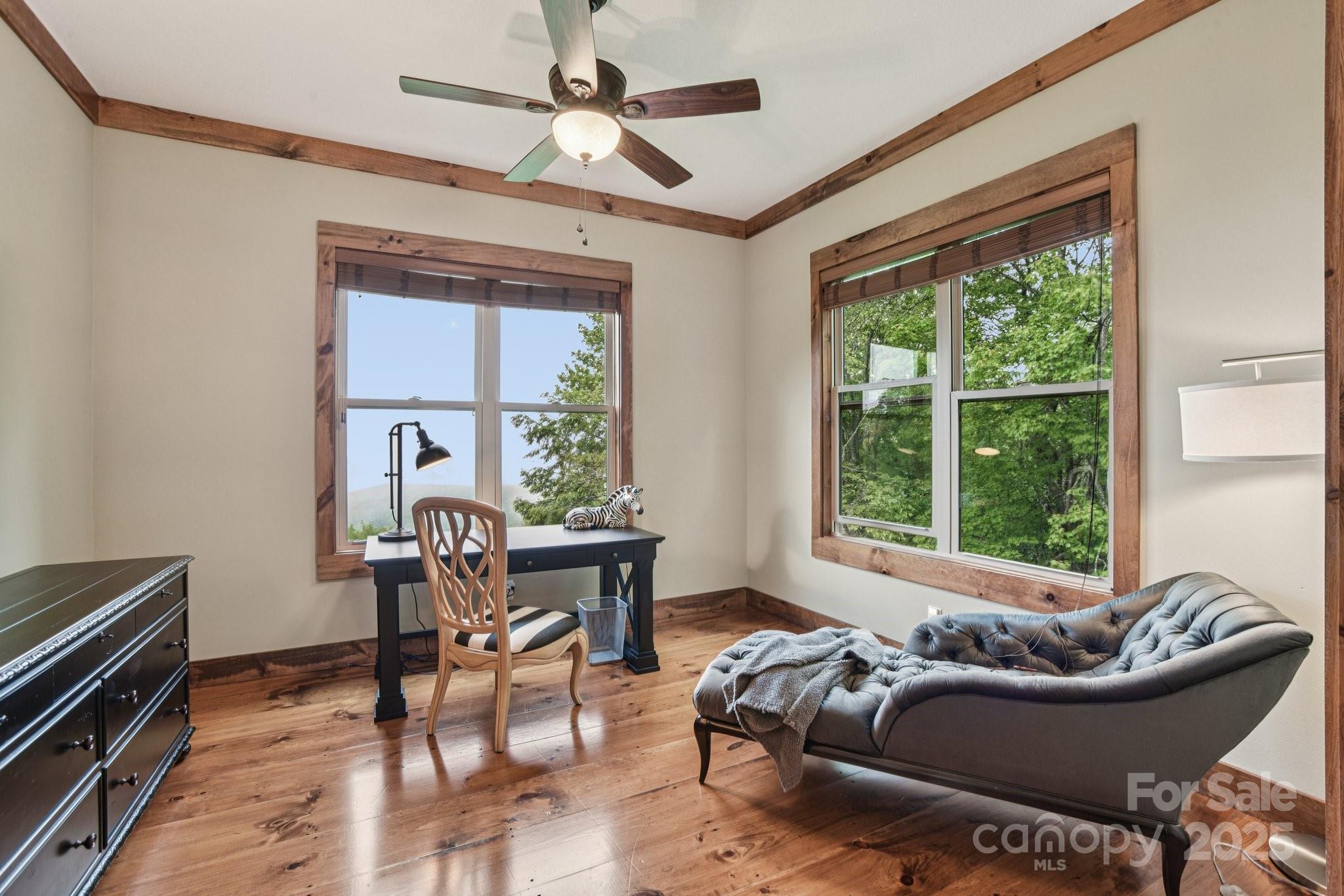 71 Raptor Way Sapphire, NC 28774 - Photo 23 of 46 a living room with furniture and a window