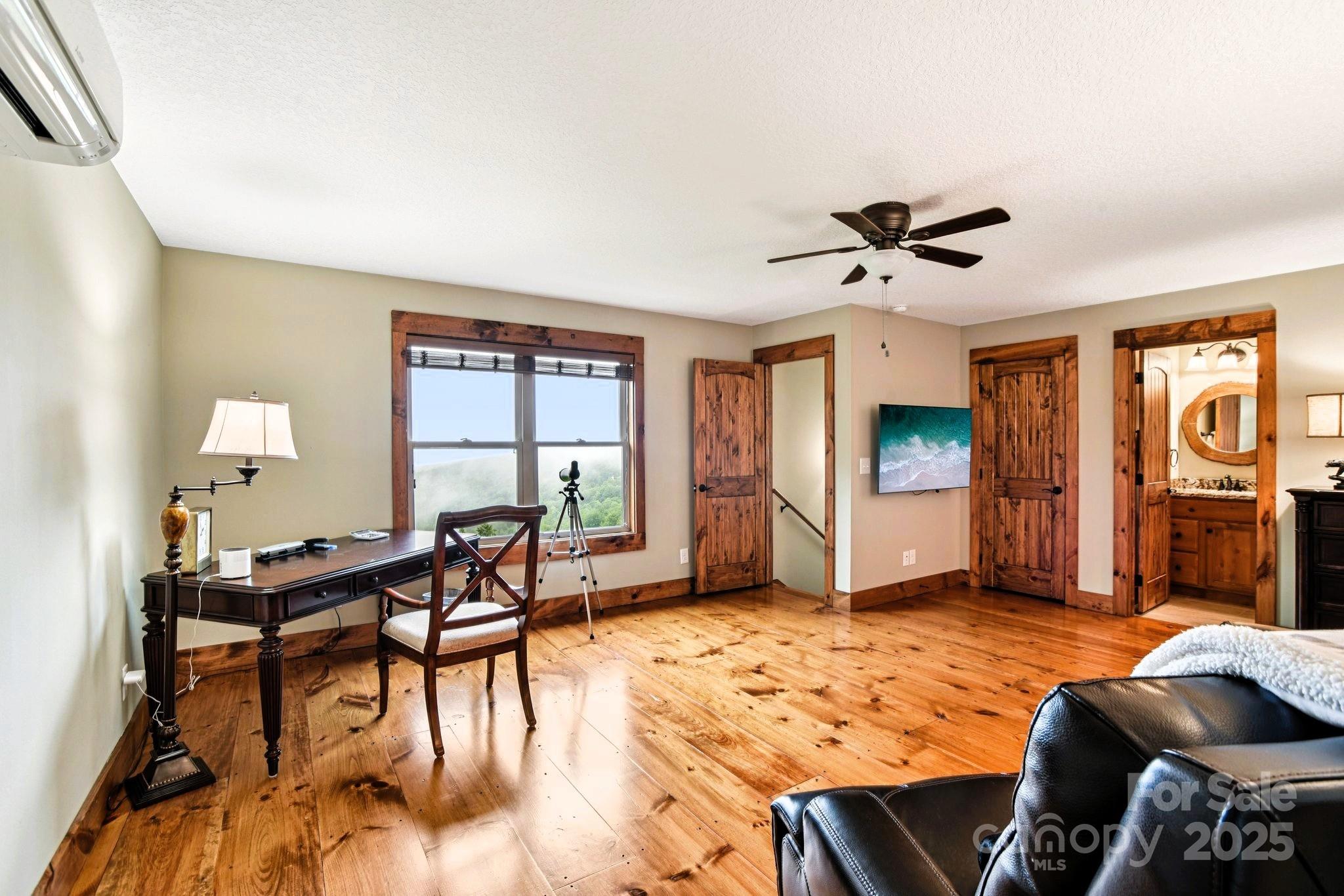 71 Raptor Way Sapphire, NC 28774 - Photo 24 of 46 a living room with furniture and a window