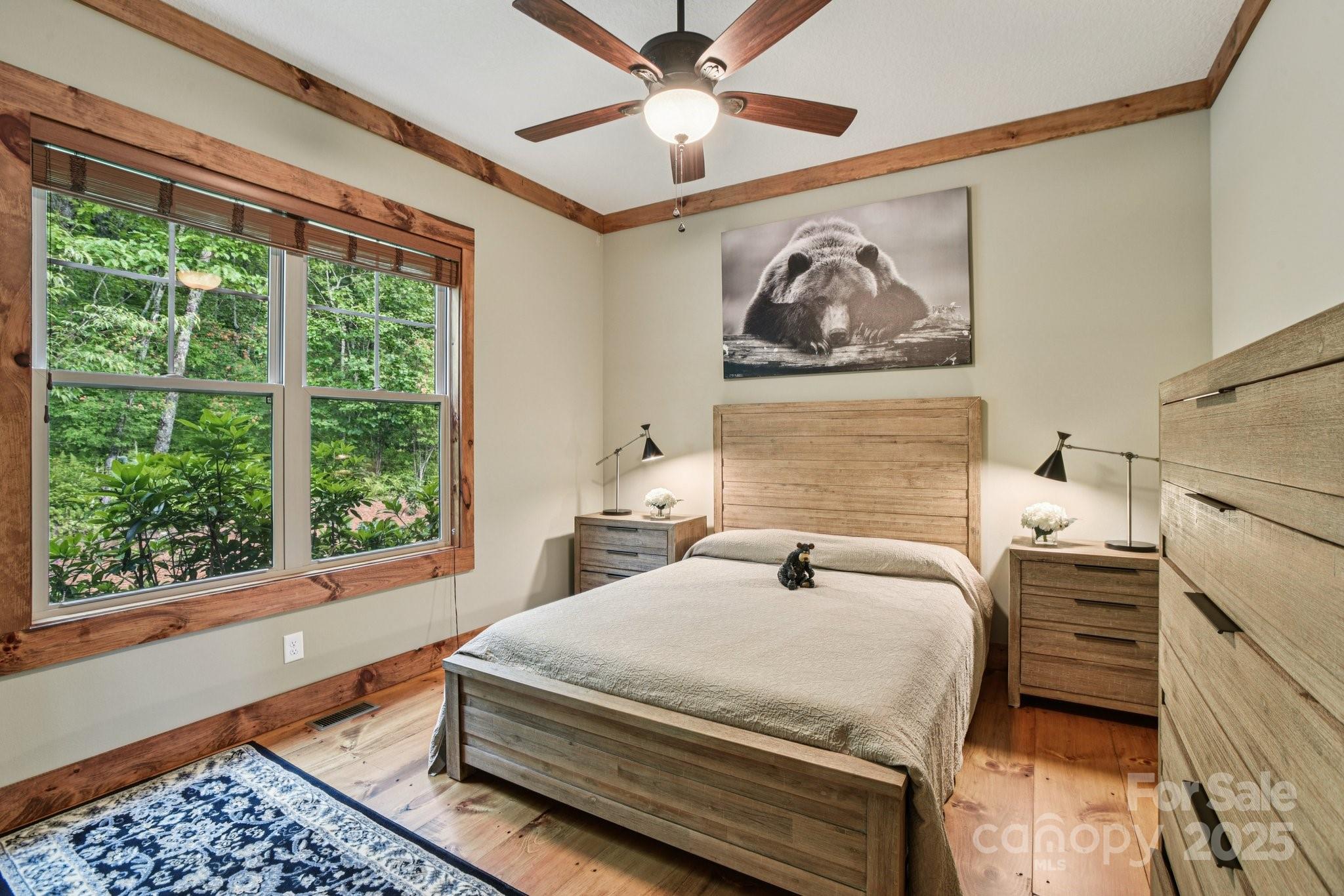 71 Raptor Way Sapphire, NC 28774 - Photo 28 of 46 a bedroom with a bed and a window