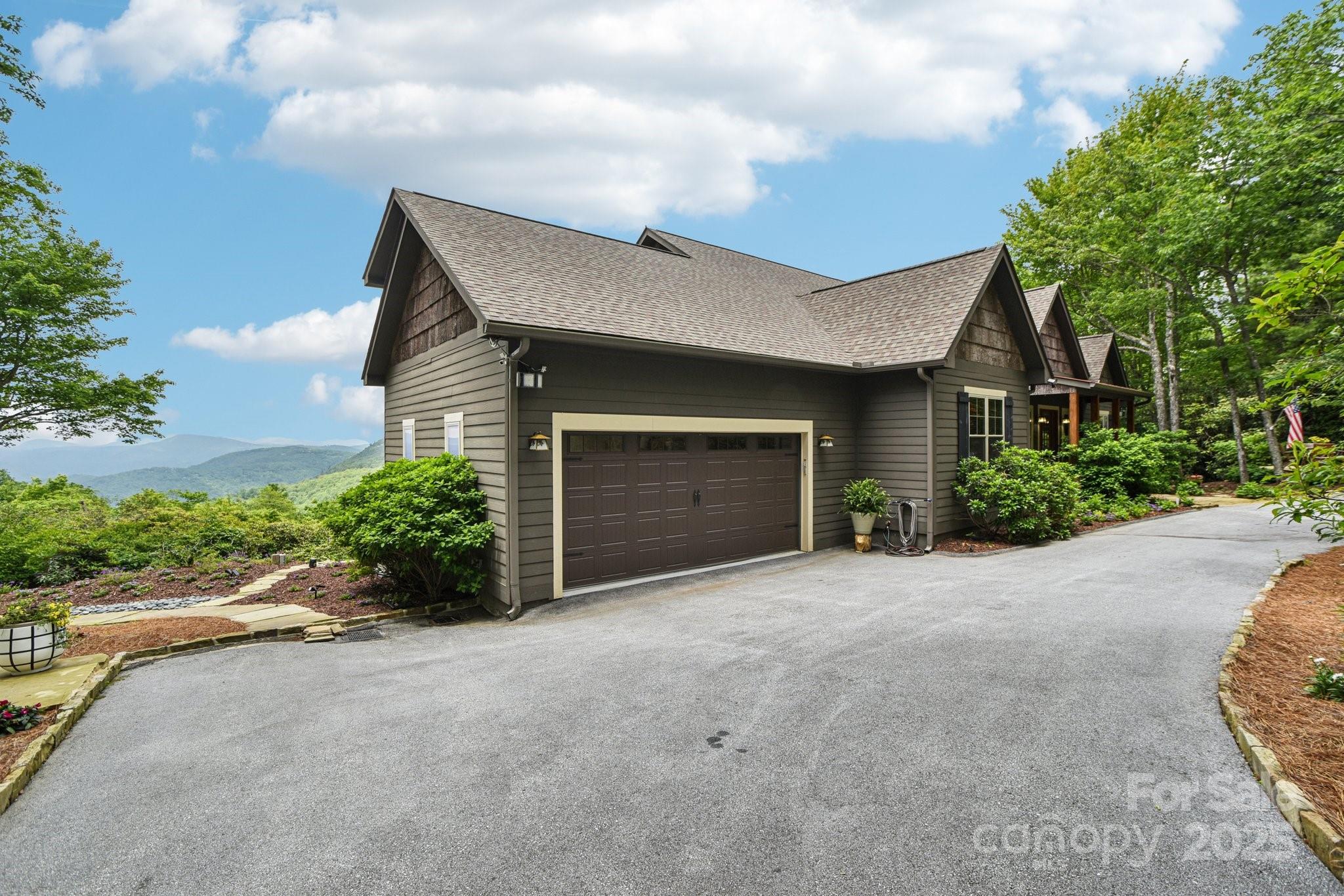 71 Raptor Way Sapphire, NC 28774 - Photo 35 of 46 a front view of a house with a garden